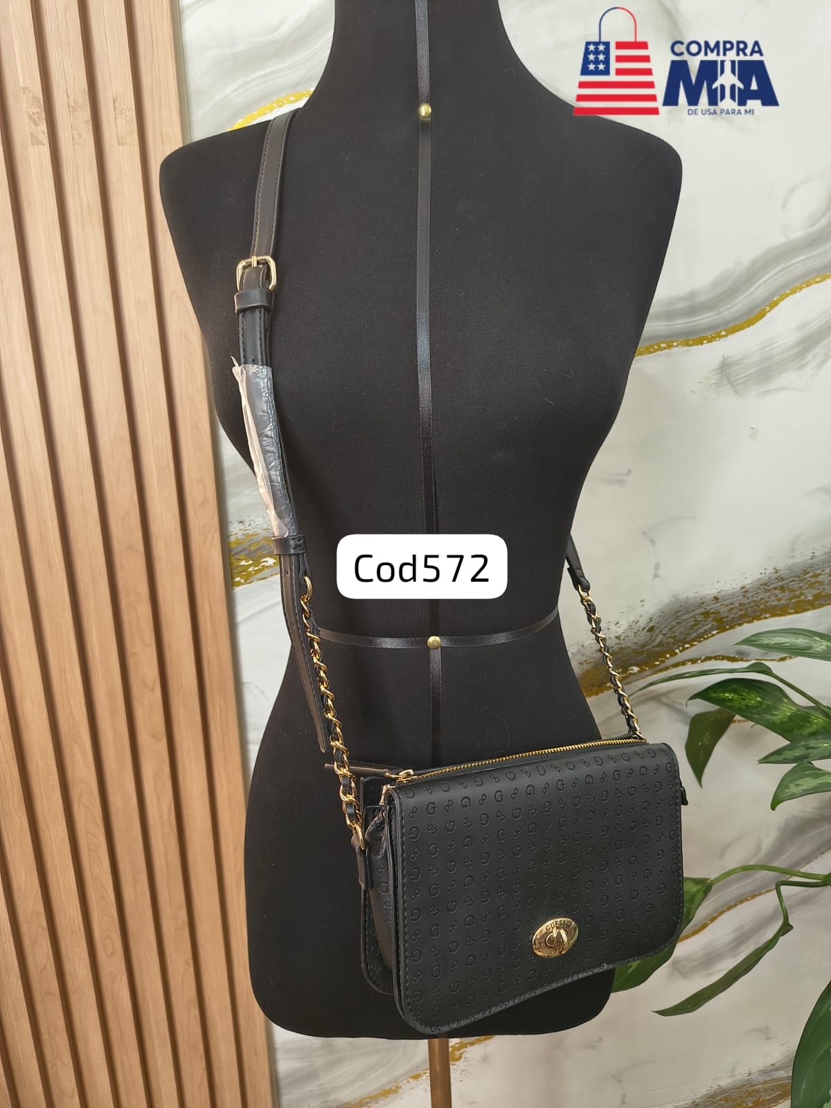 CARTERA NEGRA CON HOLOGRAMA Y ASAS DORADAS